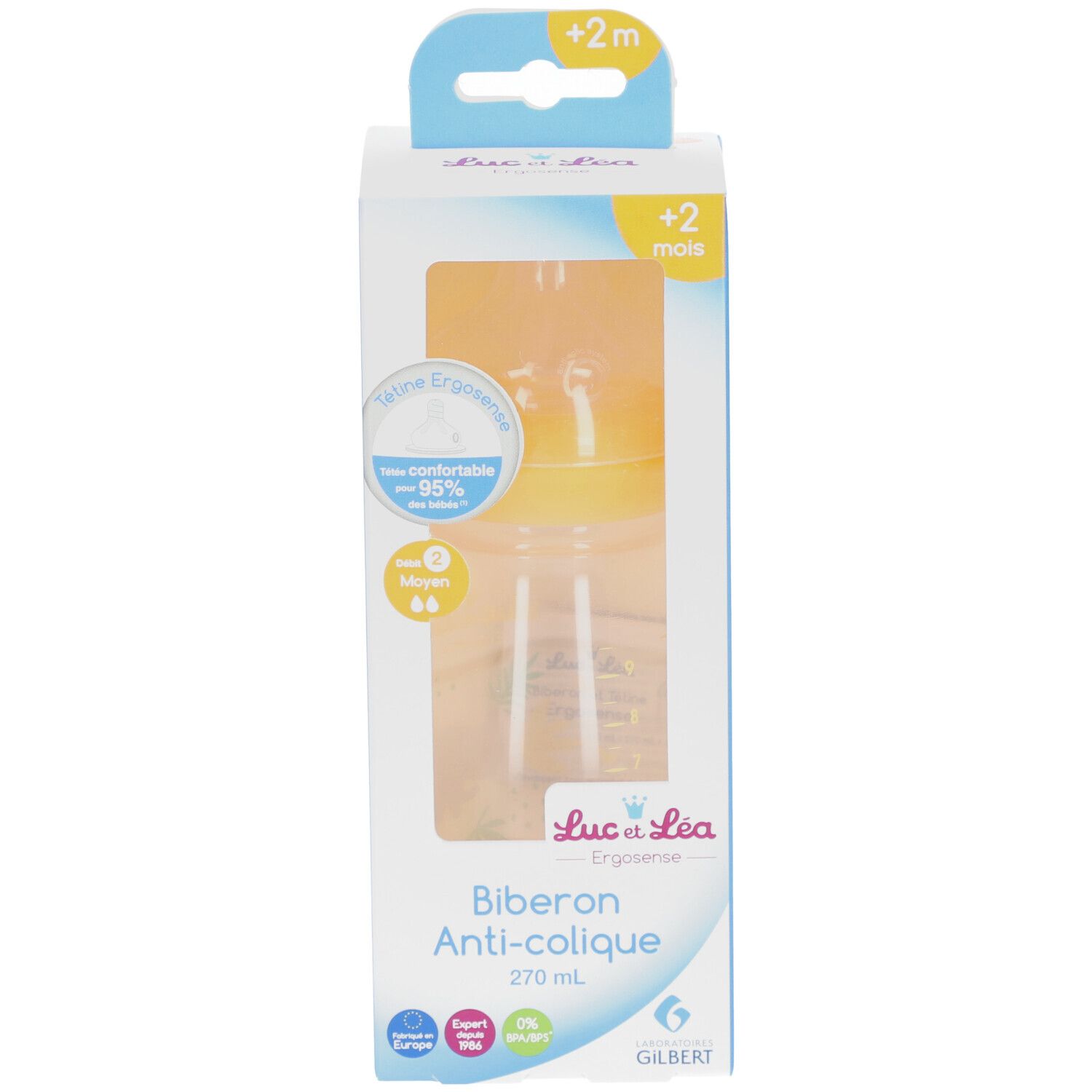 Biberon anti-colique dans son emballage. Tétine jaune, biberon transparent. Inscription: Biberon Anti-colique, 270 ml.