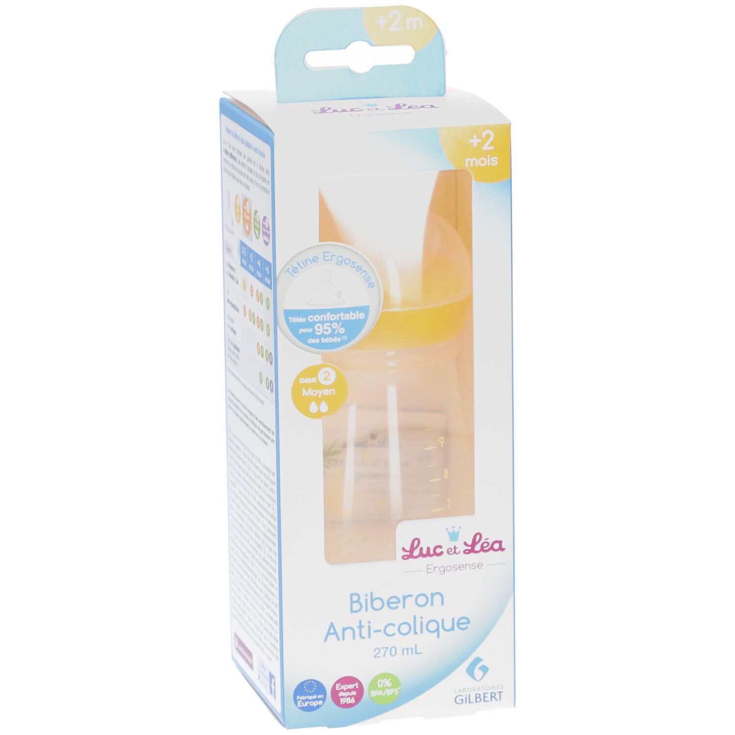 Biberon anti-colique dans son emballage. Tétine jaune, biberon transparent. Inscription: Biberon Anti-colique, 270 ml.
