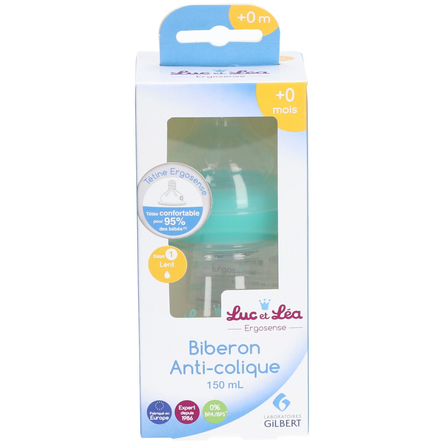 Biberon anti-colique dans son emballage. Tétine turquoise, biberon transparent. Inscription: Biberon Anti-colique, 150 ml.