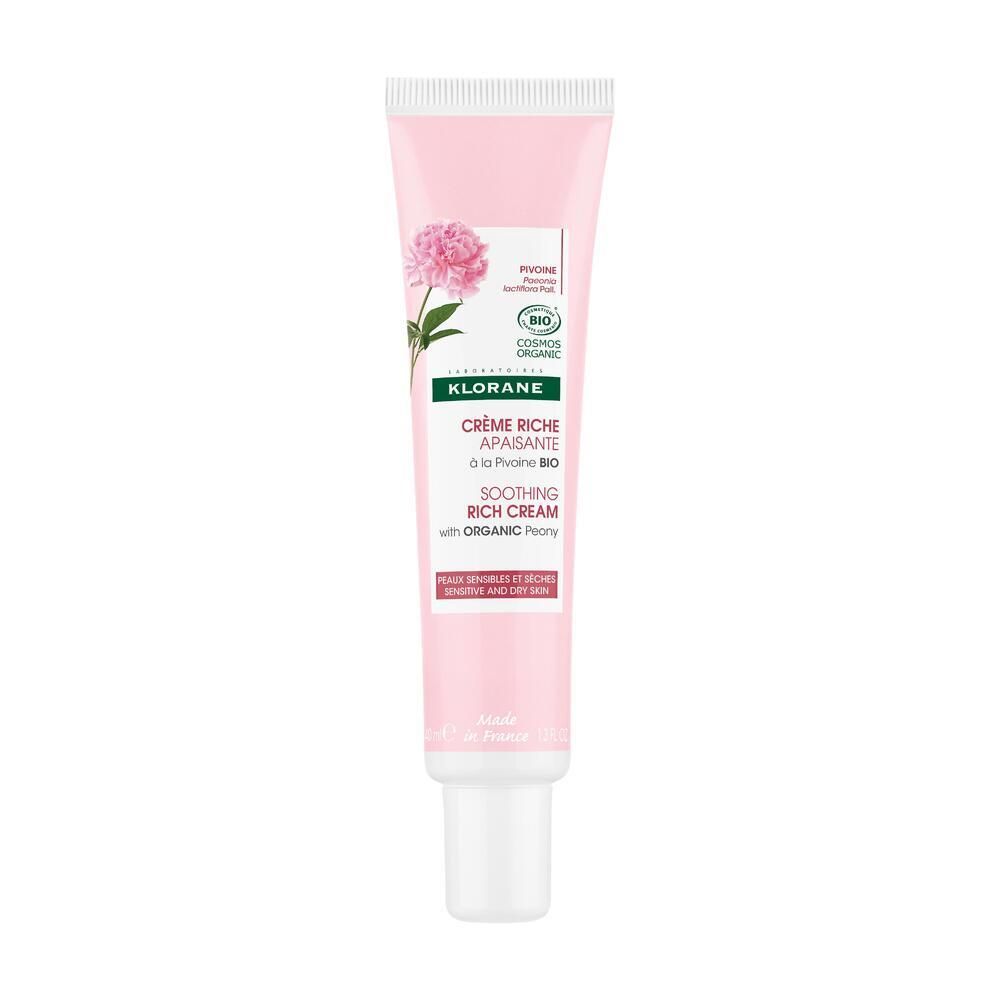 Tube rose avec bouchon blanc. Inscription : Klorane, Crème Riche Apaisante, Soothing Rich Cream. Certification bio.