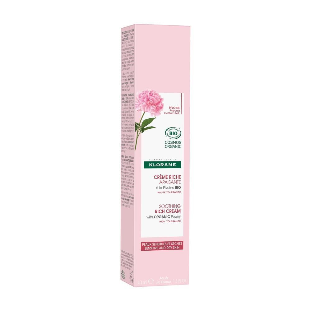Emballage rose avec texte. Inscription : Klorane, Crème Riche Apaisante, Soothing Rich Cream. Certification bio. Texte multilingue.