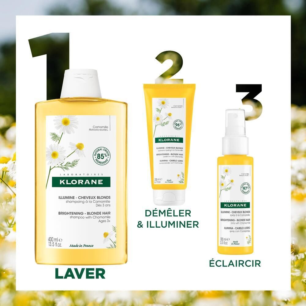 Trois produits KLORANE : shampooing, après-shampooing et spray. Tous à la camomille. Inscriptions : Laver, Démêler & Illuminer, Éclaircir.