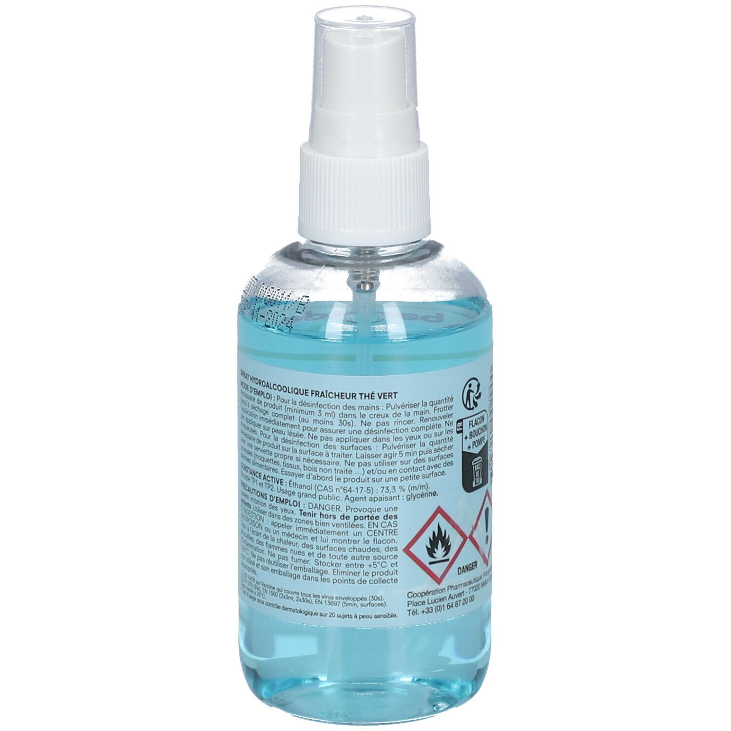 Dos d'un flacon transparent avec liquide bleu. Texte et pictogrammes sur l'étiquette. Flacon avec vaporisateur.
