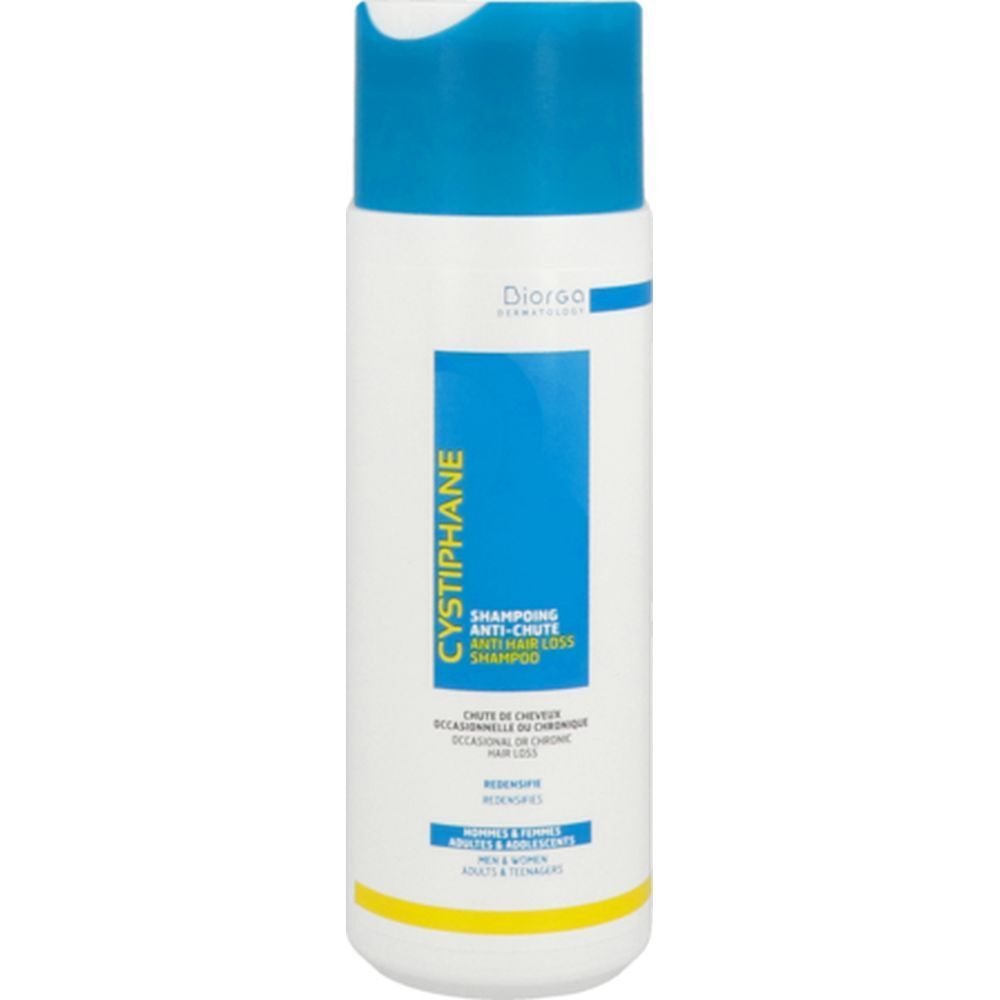 Flacon blanc et bleu avec étiquette de shampooing. Texte : Cystiphane, Shampooing antichute. Marque : Diorga.