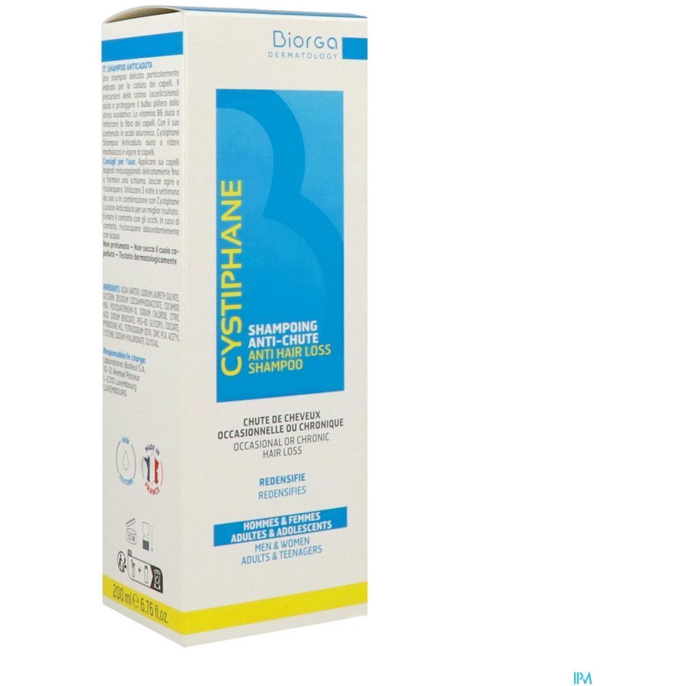 Emballage avec étiquette de shampooing. Texte : Cystiphane, Shampooing antichute. Marque : Diorga. Pour hommes, femmes et adolescents.