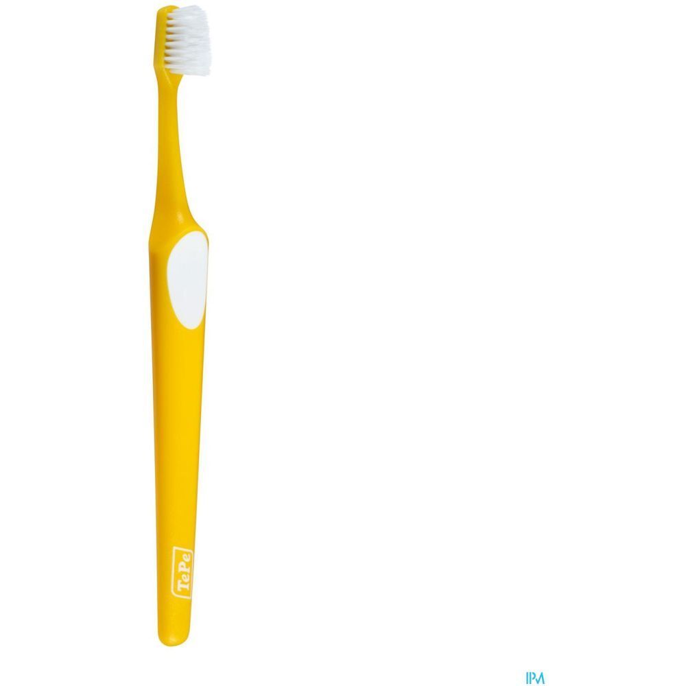 Brosse à dents jaune avec tête blanche. Marque TePe.