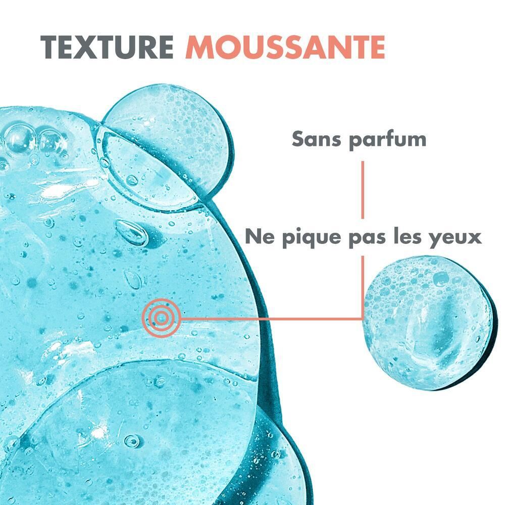 Gros plan sur gel bleu. Texte: Texture moussante, sans parfum, ne pique pas les yeux.