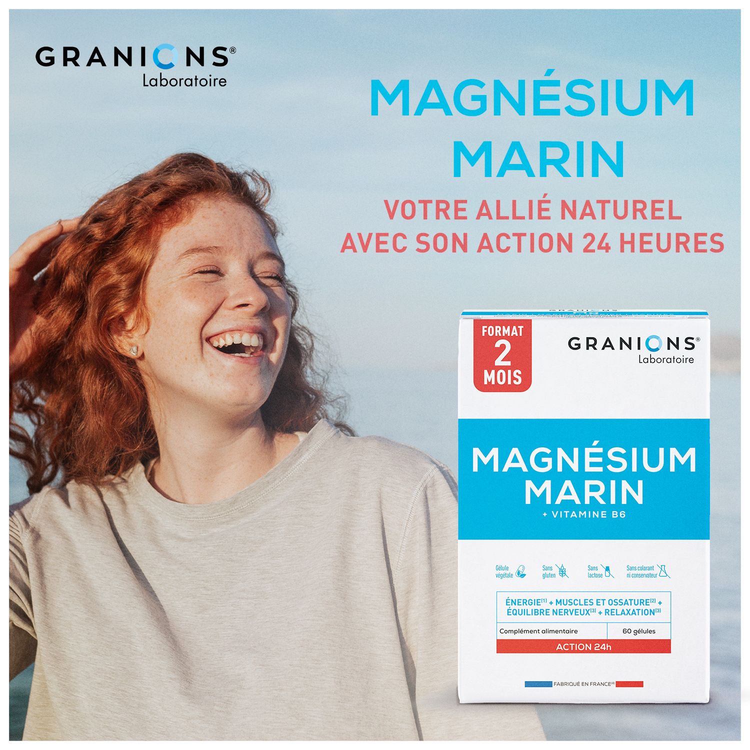 Frau lächelt. Im Hintergrund Meer. Rechts: Granions Magnesium Marin Packung. 60 Kapseln.