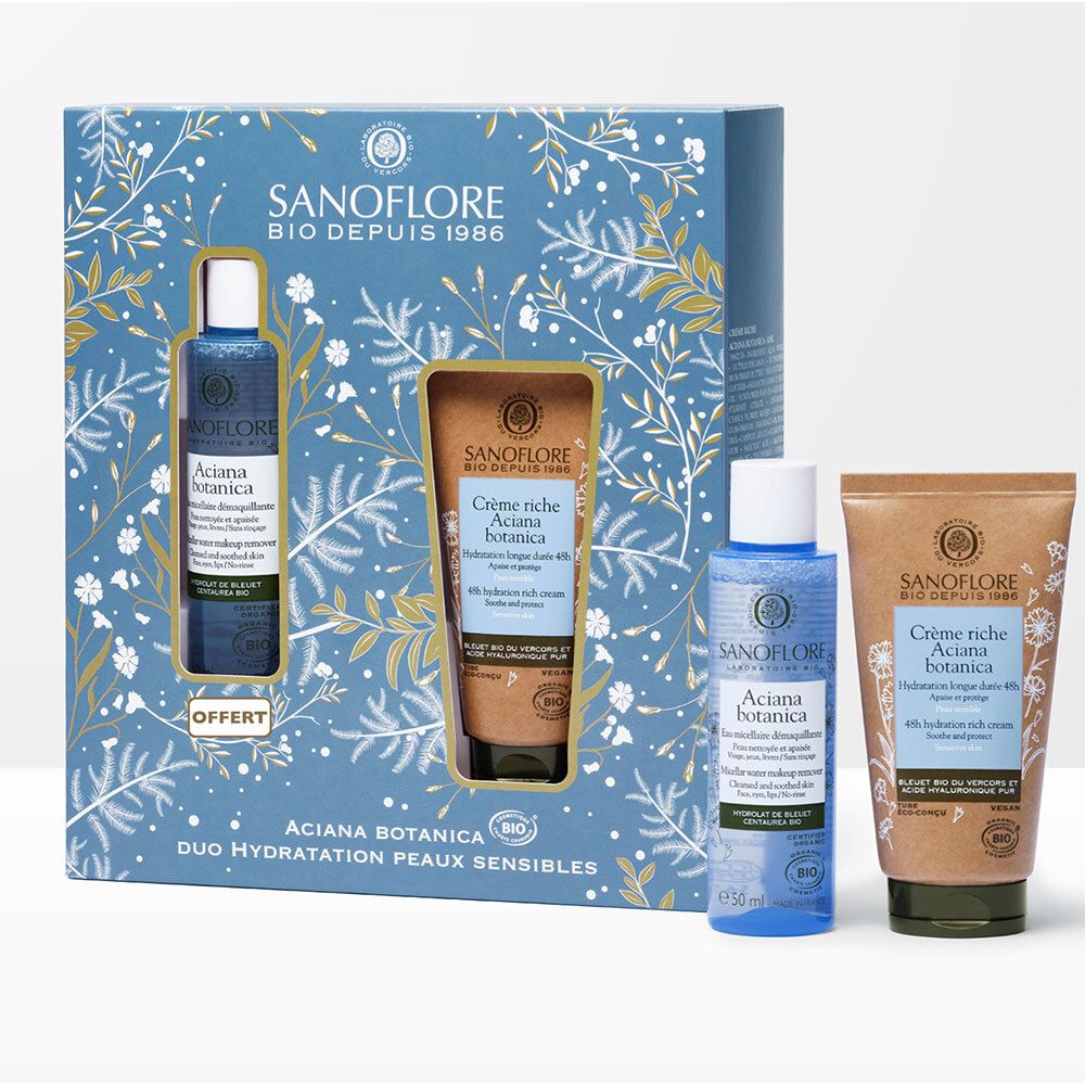 Coffret cadeau avec deux produits. Emballages bleus et bruns avec motifs floraux. Texte : SANOFLORE, Aciana botanica, Duo Hydratation Peaux Sensibles.