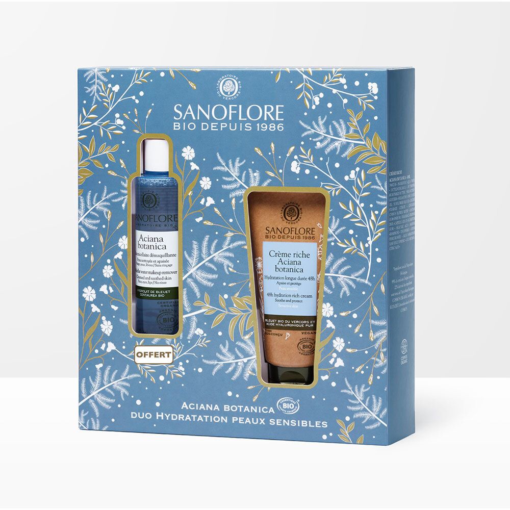 Coffret cadeau avec deux produits. Emballages bleus et bruns avec motifs floraux. Texte : SANOFLORE, Aciana botanica, Duo Hydratation Peaux Sensibles.