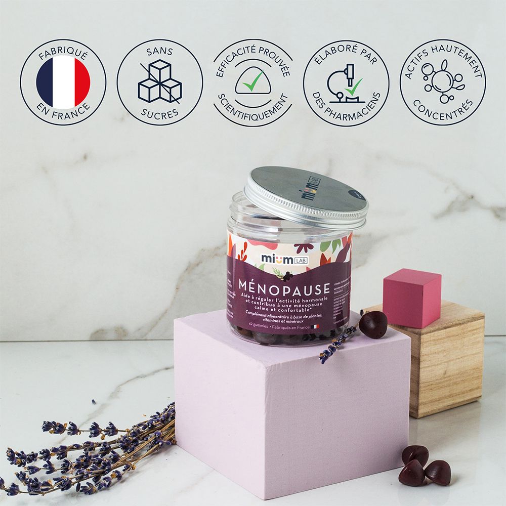 Produit sur socle. Inscription: Ménopause, sans sucres. Certifications: Fabriqué en France, sans sucres.