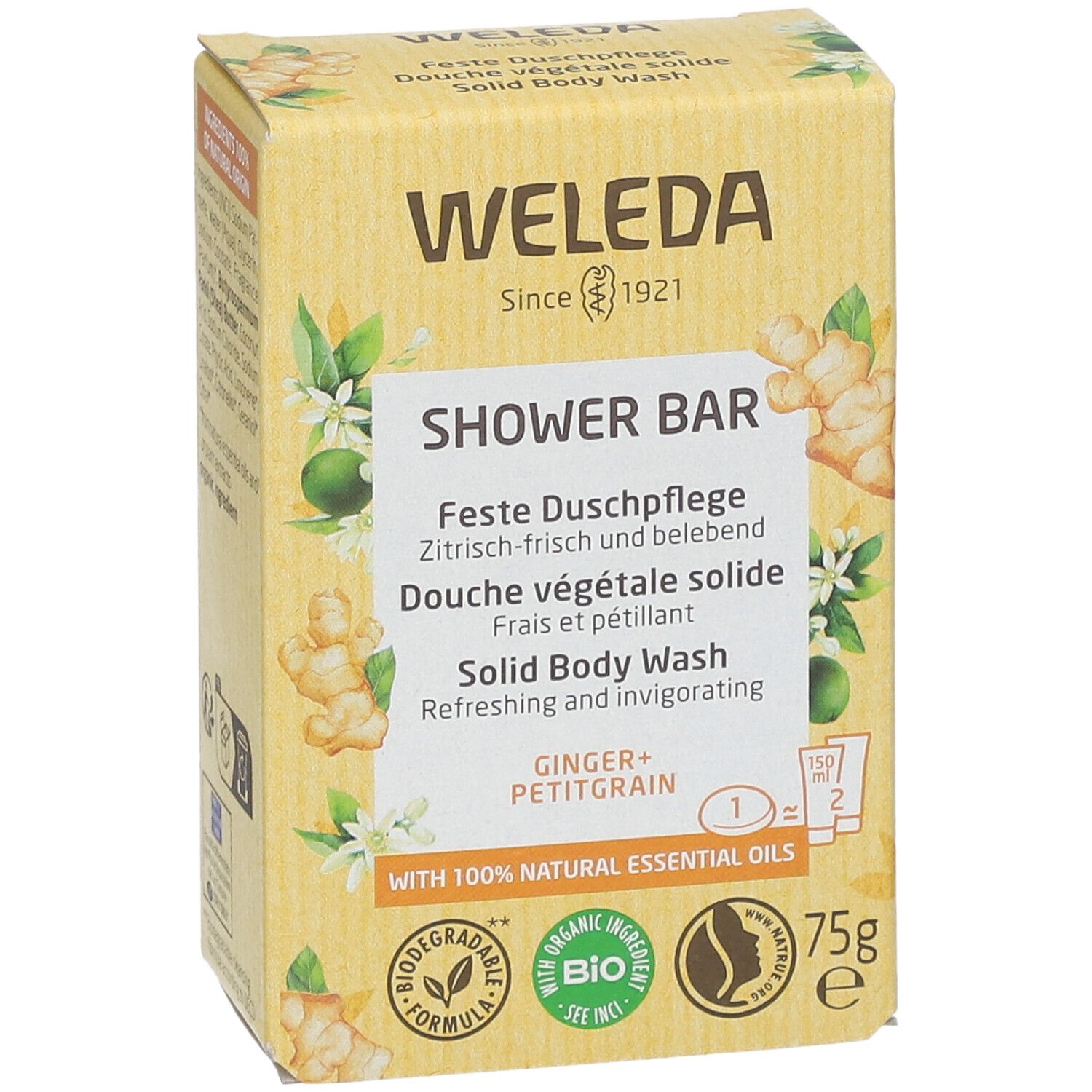 Gelbe Kartonverpackung. Aufschrift: WELEDA, SHOWER BAR, Feste Duschpflege, Ginger + Petitgrain. Mit Bio-Siegel und 75g.