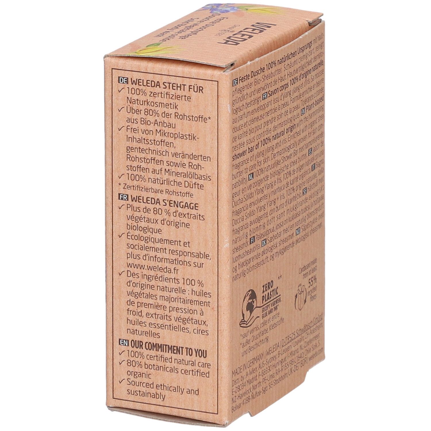 Boîte avec texte multilingue. Inscription : WELEDA S'ENGAGE. Plus de 80% d'extraits végétaux d'origine biologique. 100% parfums naturels.