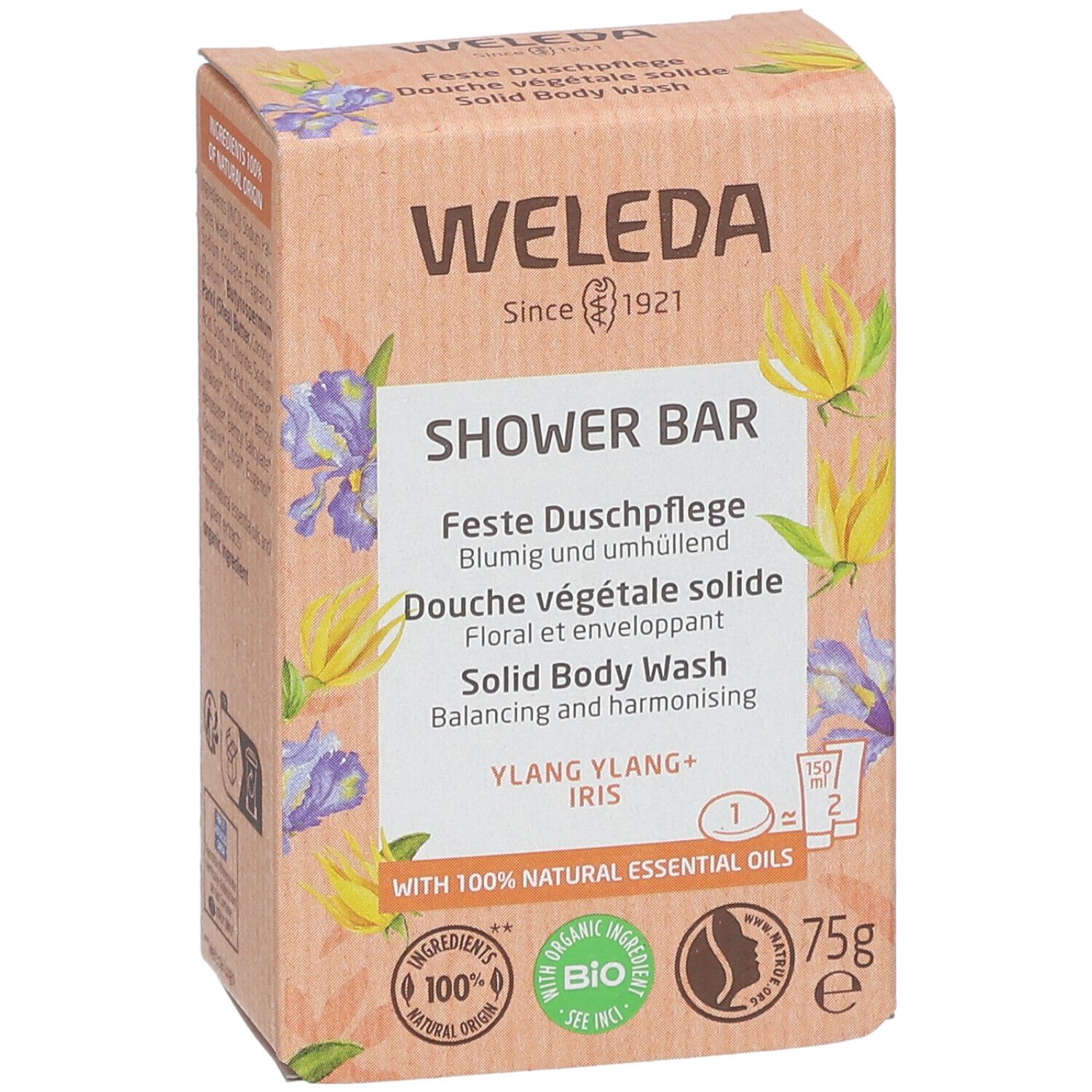 Boîte WELEDA. Inscription : SHOWER BAR, Douche végétale solide, Ylang Ylang + Iris. Avec 100% huiles essentielles naturelles. 75g.