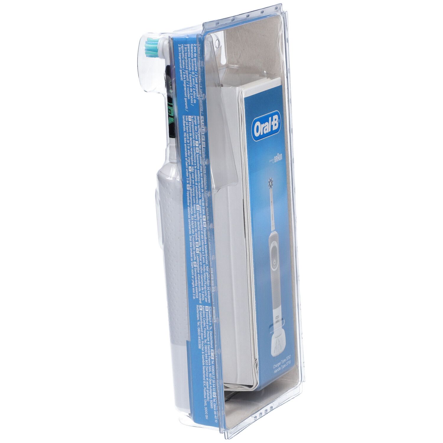Emballage avec brosse à dents électrique et socle de chargement. Visible : Oral-B Kids, socle de chargement. Emballage bleu, brosse et socle blancs.