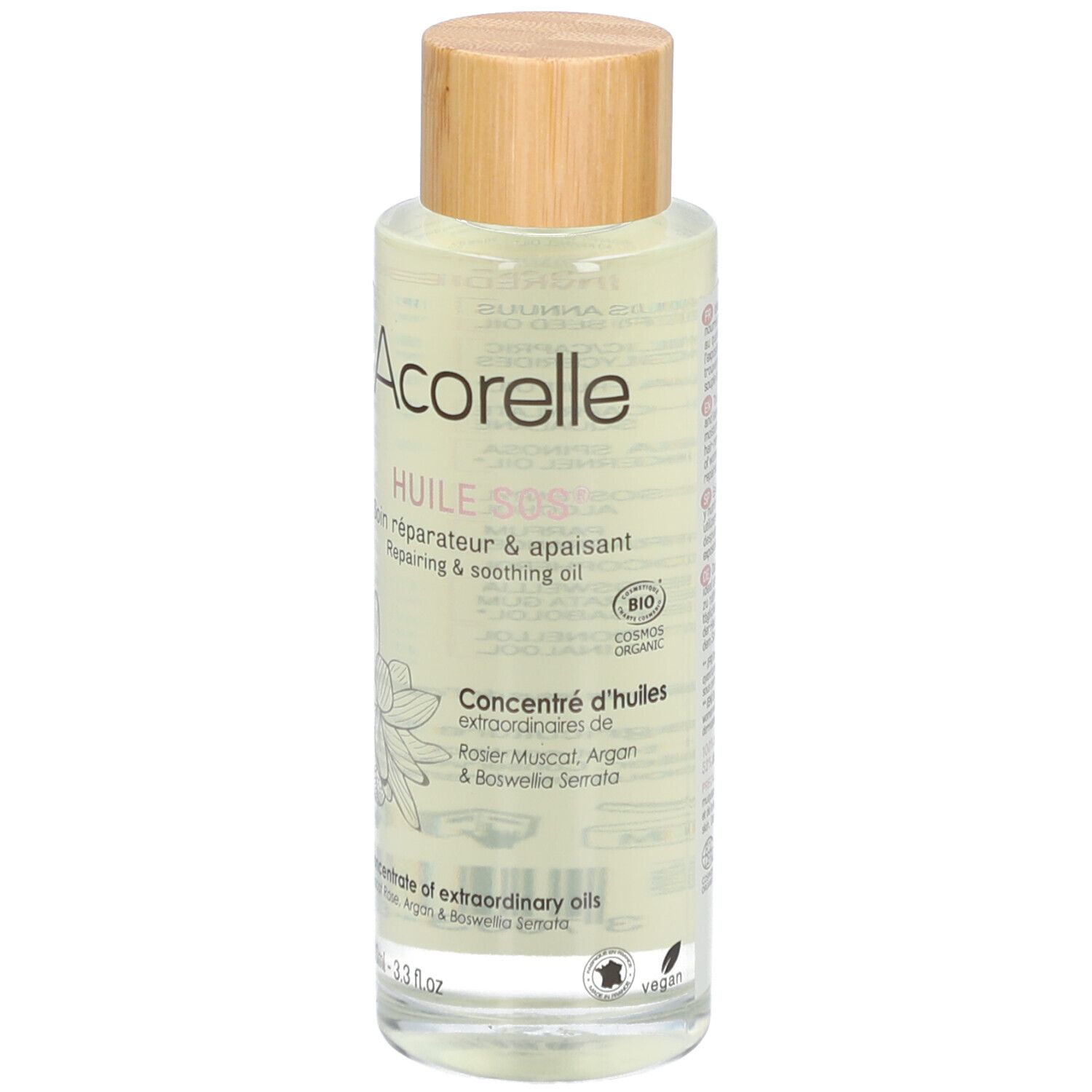 Flacon en verre transparent avec bouchon en bois. Inscription: Acorelle, Huile SOS, Soin réparateur & apaisant. Label Bio.