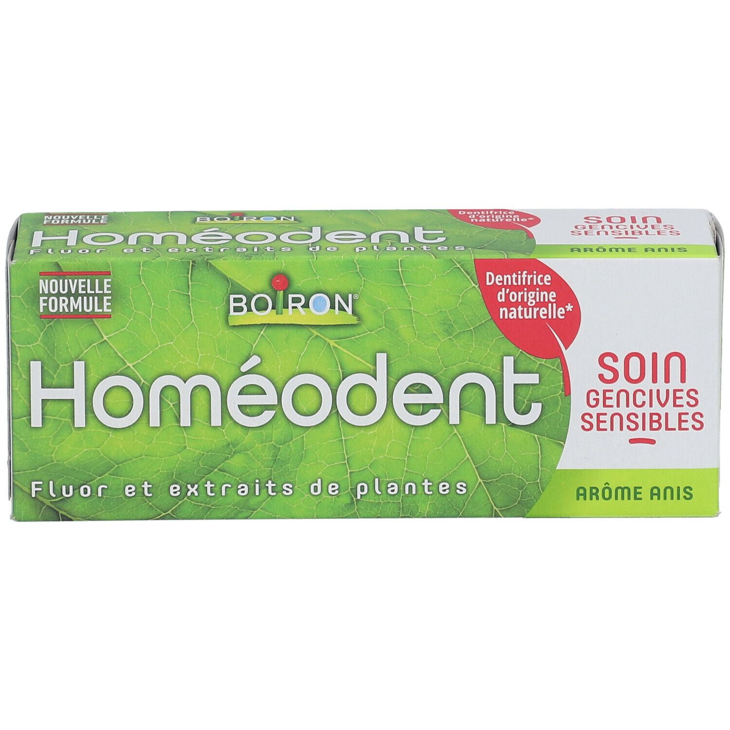 Homéodent-Verpackung, grüne Blätter, Text: Fluor und Pflanzenextrakte, Soin gencives sensibles, Aromatisierter Anis.