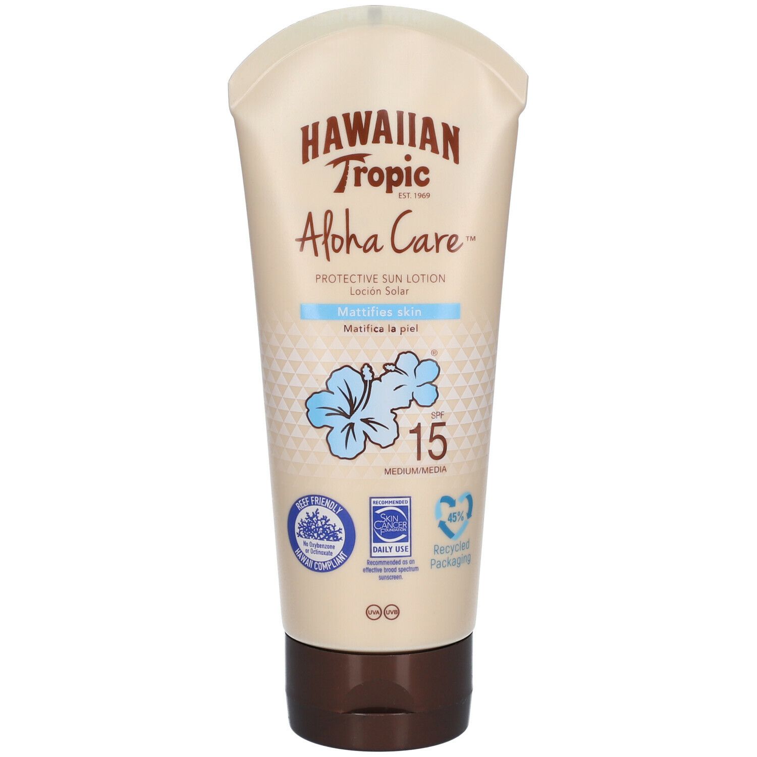 Sonnenlotion-Tube. "Hawaiian Tropic Aloha Care" mit SPF 15. Hellbraune Tube mit braunem Deckel. Blaue Blume.