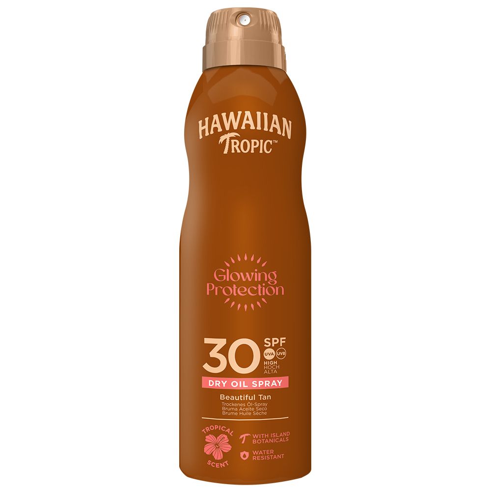 Flacon spray marron avec bouchon doré. Inscription: HAWAIIAN Tropic, Glowing Protection, 30 SPF. Huile sèche noix de coco.