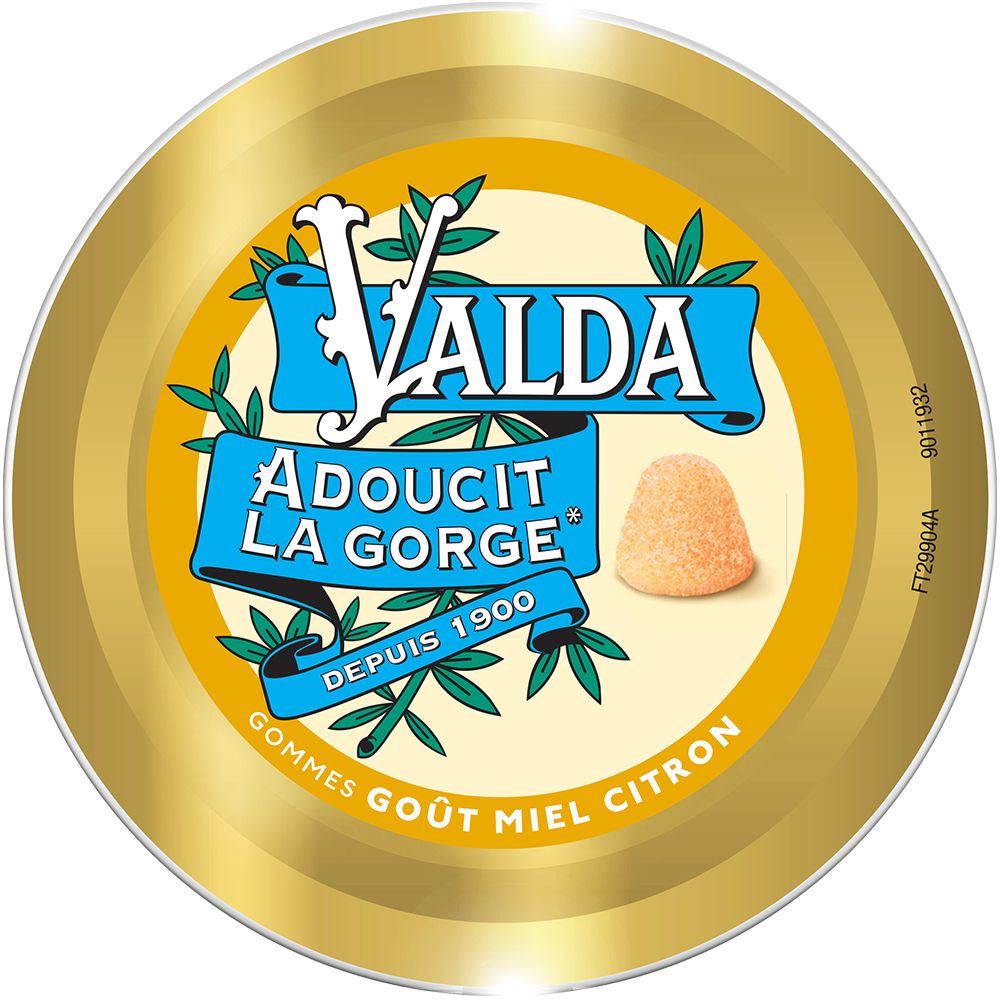 Deckel einer goldfarbenen Dose mit blau-gelbem Etikett. Aufschrift: VALDA, Adoucit la Gorge, Depuis 1900. Gummibärchen-Abbildung.