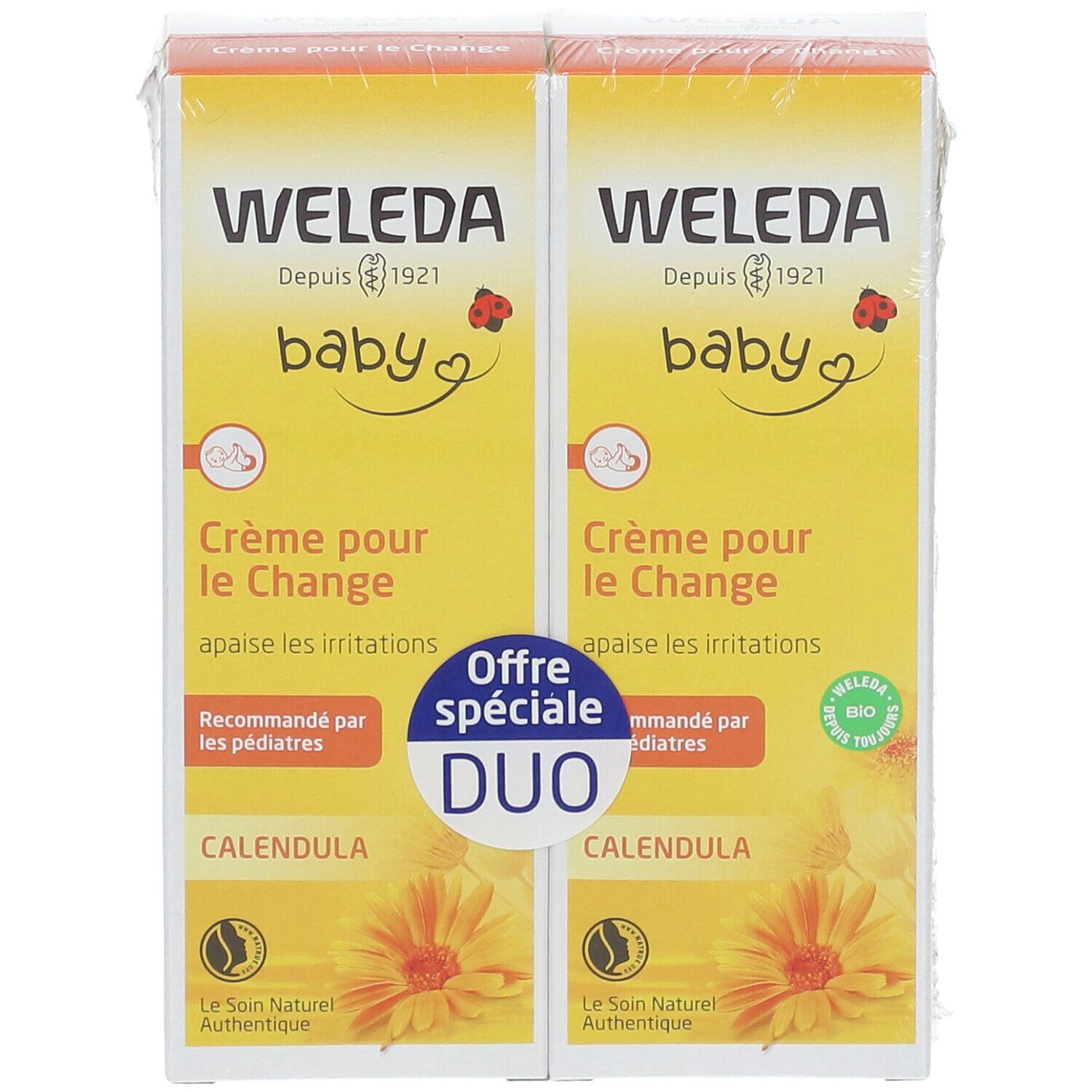 Deux boîtes jaunes "WELEDA baby Crème pour le Change". Duo avec "Calendula".