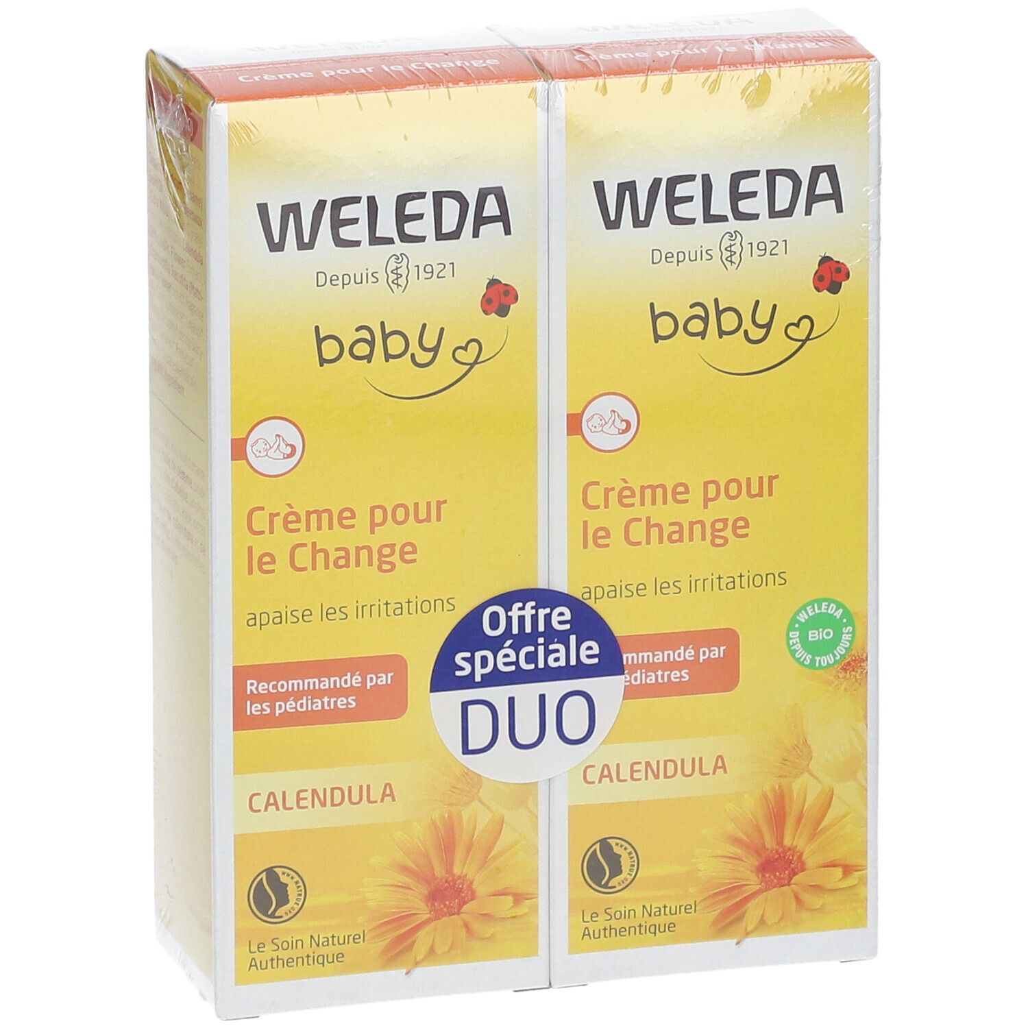 Deux boîtes jaunes "WELEDA baby Crème pour le Change". Duo avec "Calendula".