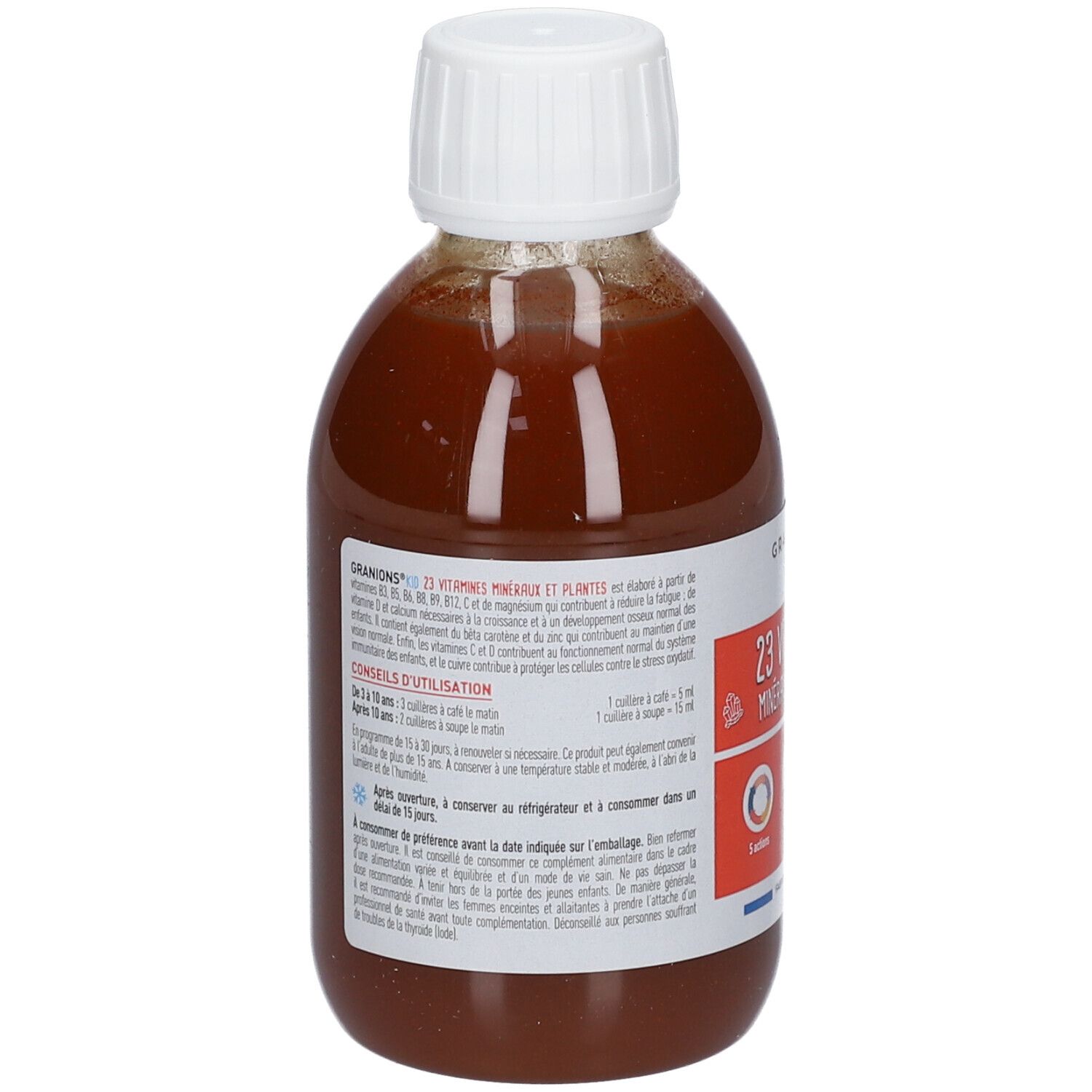 Dos du flacon de liquide brun avec bouchon blanc. Étiquette avec informations sur GRANIONS® KID, 23 Vitamines, Minéraux & Plantes.