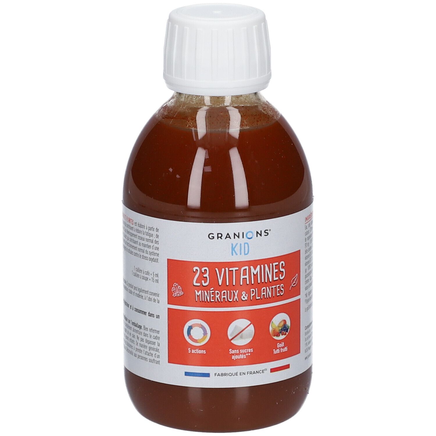 Flacon de liquide brun avec bouchon blanc. Étiquette GRANIONS® KID, 23 Vitamines, Minéraux & Plantes. Drapeau français.
