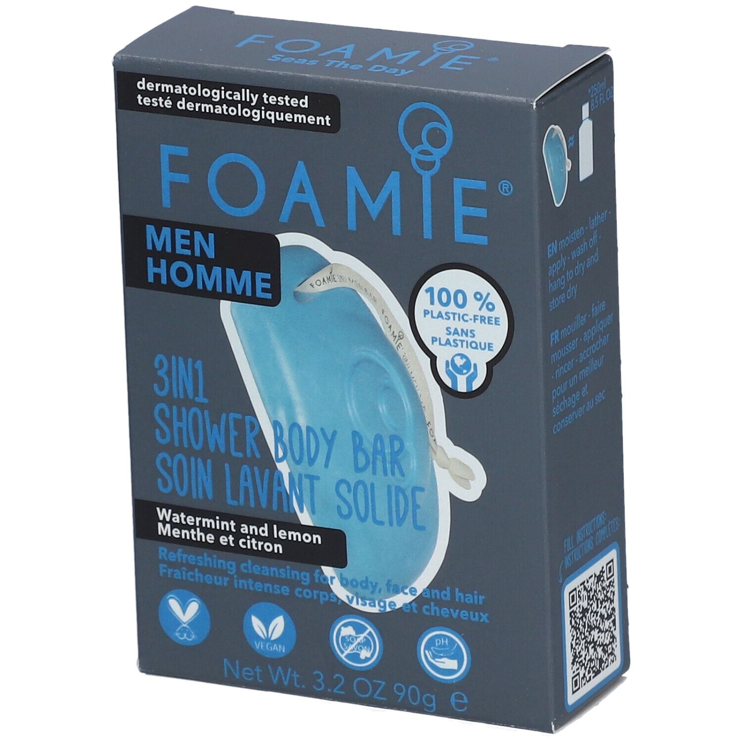 Boîte bleu-gris avec logo FOAMIE et informations produit. Contient un pain de douche solide 3-en-1 bleu. Texte: Men Homme, Watermint & Lemon.