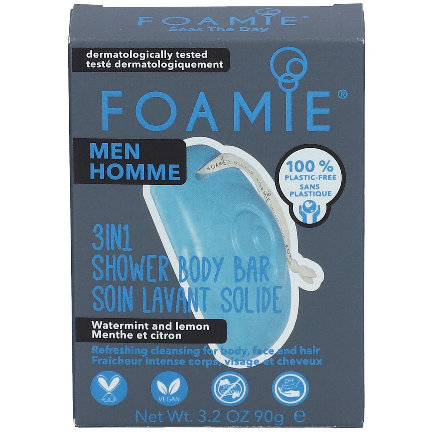 Boîte bleu-gris avec logo FOAMIE et informations produit. Contient un pain de douche solide 3-en-1 bleu. Texte: Men Homme, Watermint & Lemon.