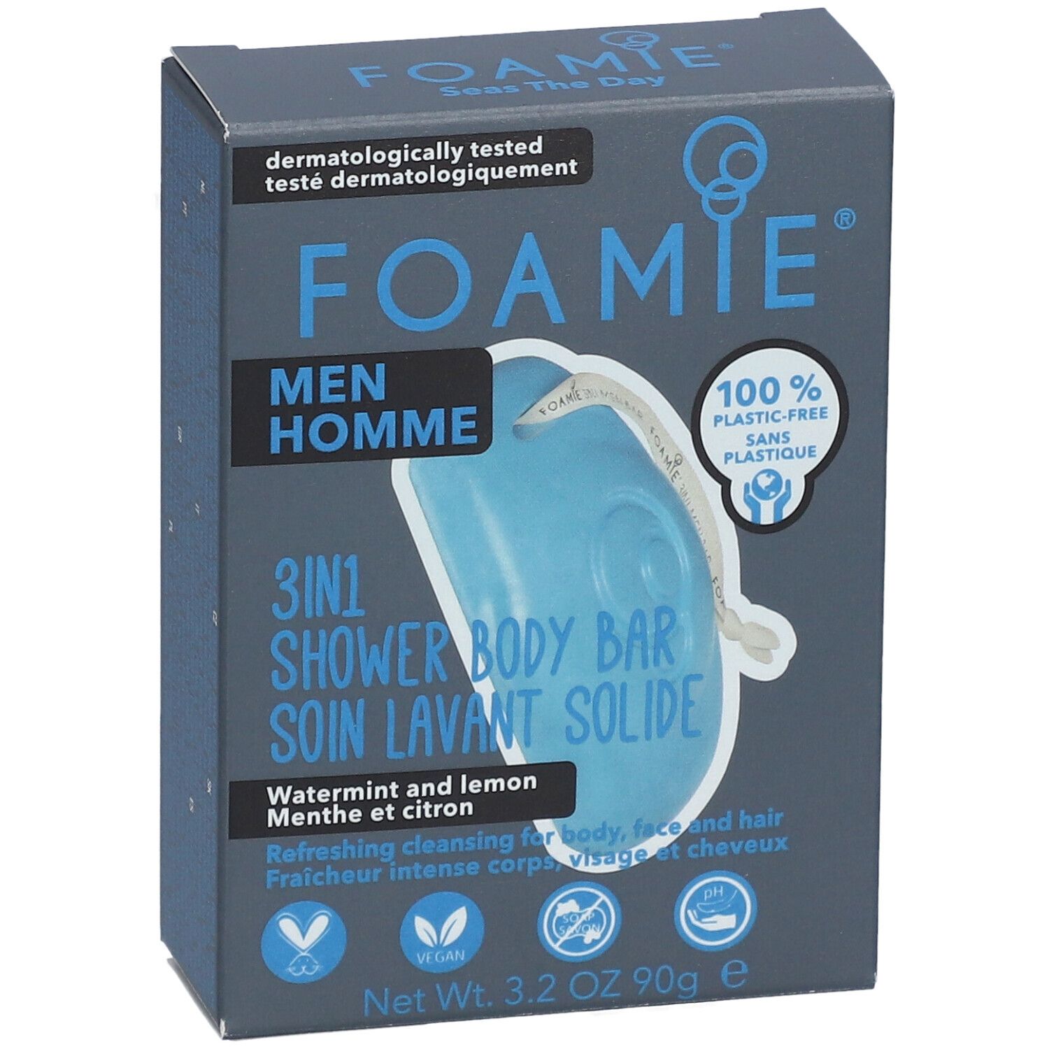 Boîte bleu-gris avec logo FOAMIE et informations produit. Contient un pain de douche solide 3-en-1 bleu. Texte: Men Homme, Watermint & Lemon.