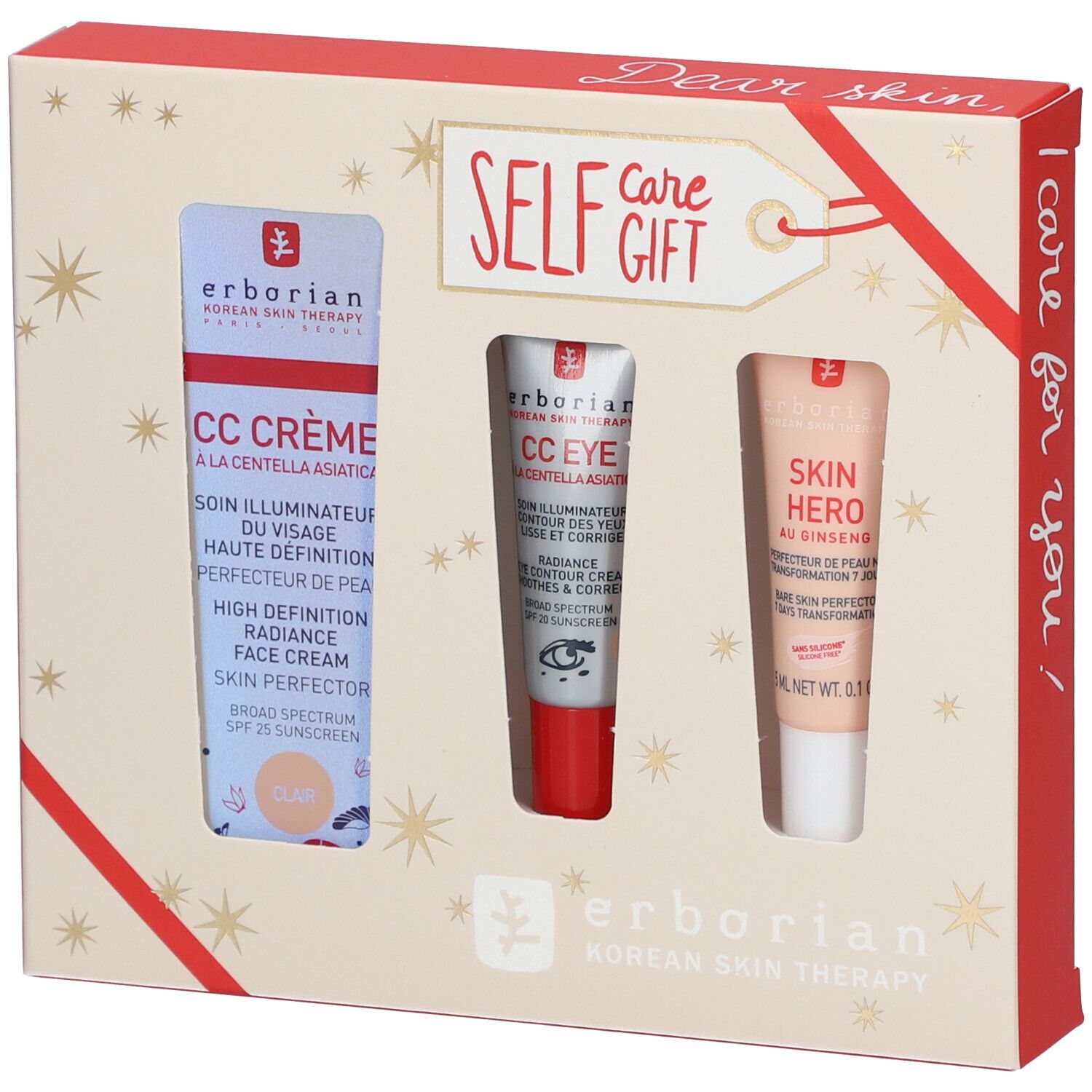 Coffret cadeau avec trois produits cosmétiques. Emballage avec étoiles et ruban rouge. Logo Erborian.