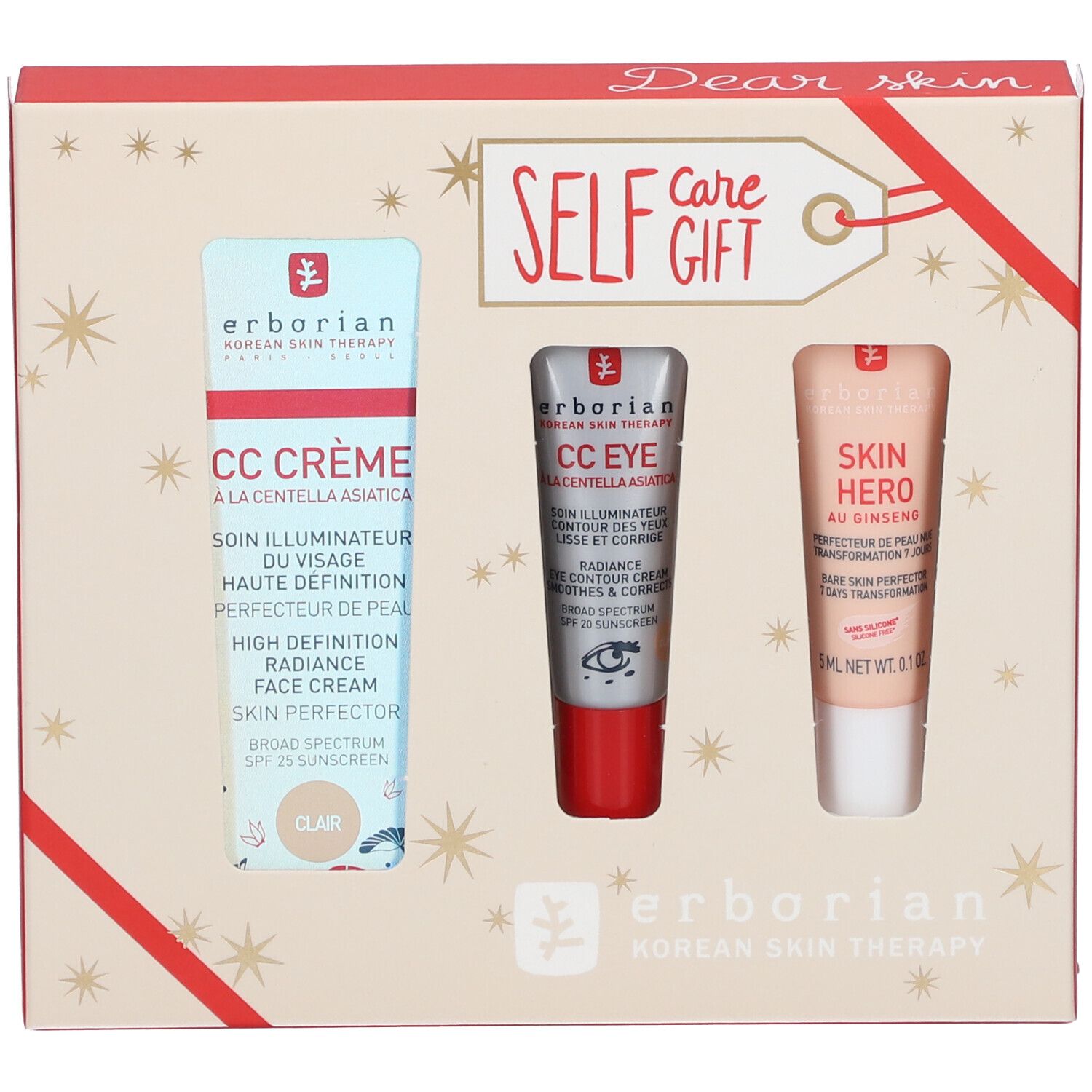 Coffret cadeau avec trois produits cosmétiques. Emballage avec étoiles et ruban rouge. Logo Erborian.