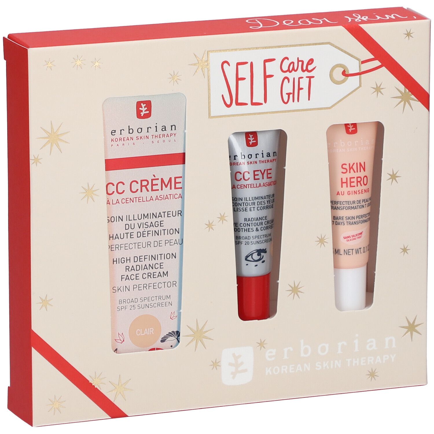 Coffret cadeau avec trois produits cosmétiques. Emballage avec étoiles et ruban rouge. Logo Erborian.