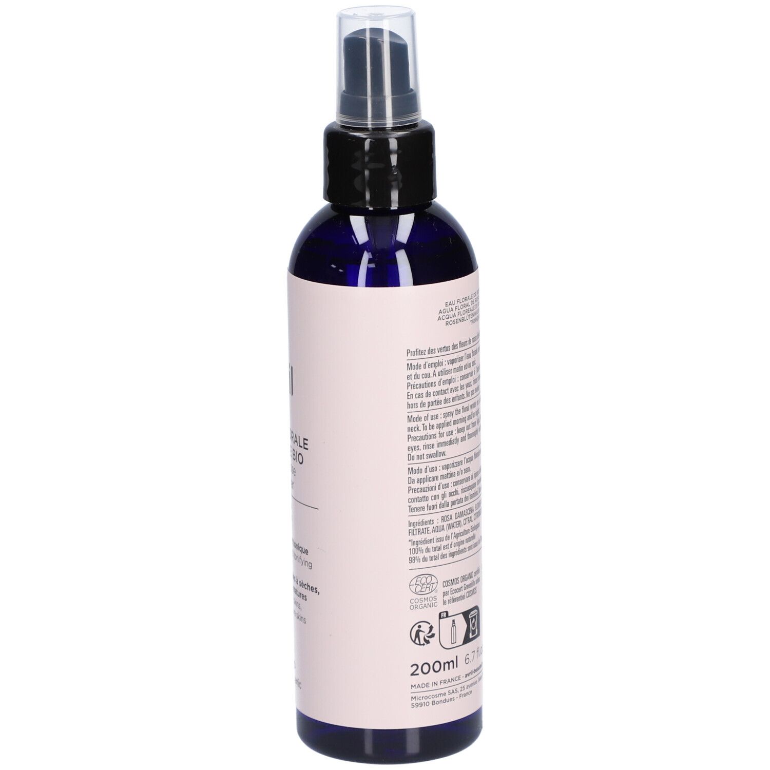 Dunkelblaue Sprühflasche mit rosa Etikett. Text auf der Rückseite. Produktinformationen, Inhaltsstoffe und Anweisungen.