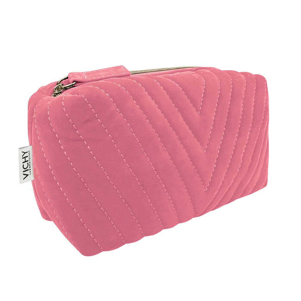 Trousse de maquillage rose avec fermeture éclair. Design matelassé avec coutures en V. Étiquette Vichy.