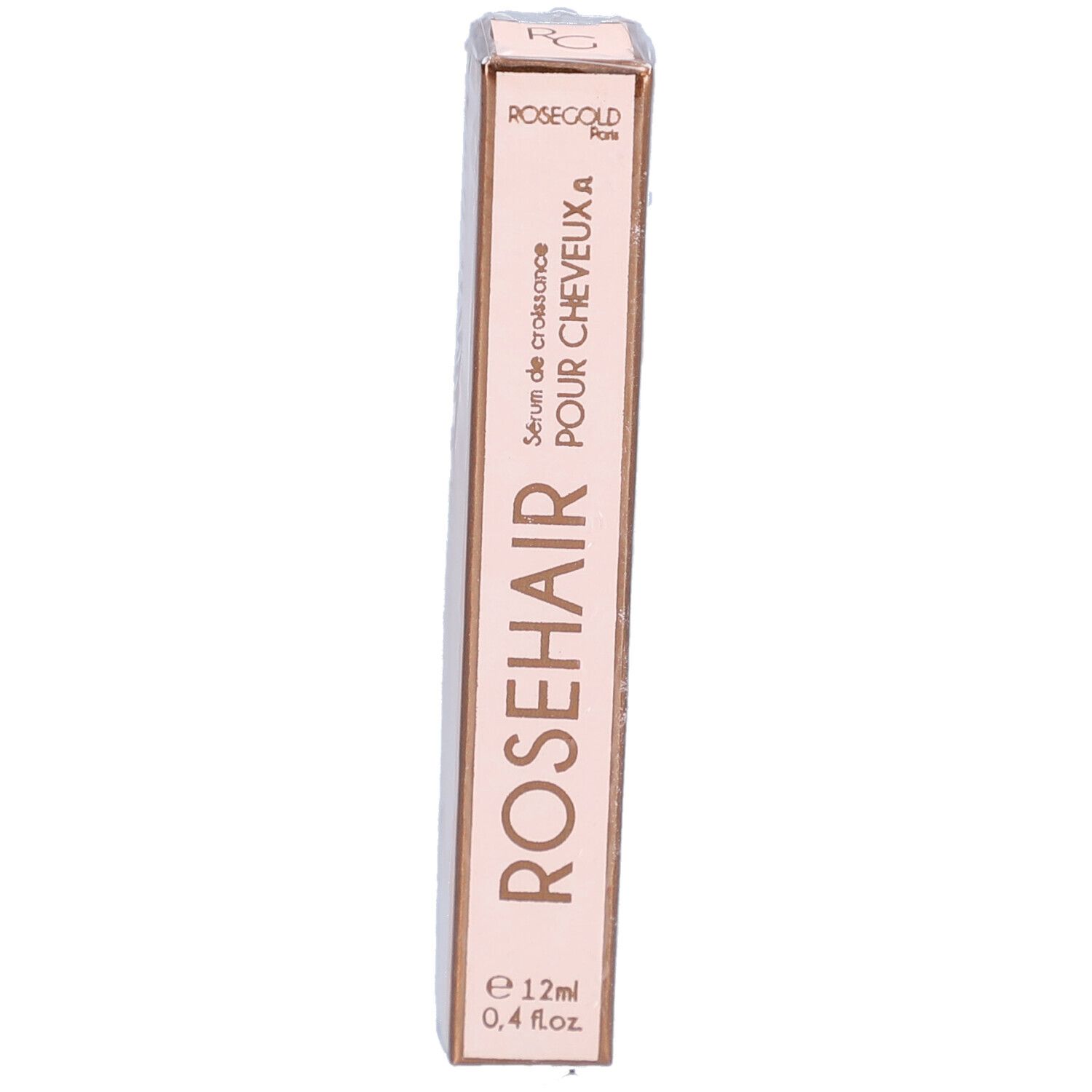 Schmale, rosafarbene Verpackung. Aufschrift: ROSEHAIR, Serum de croissance POUR CHEVEUX A, e 12ml, 0,4 fl.oz. ROSEGOLD Paris.
