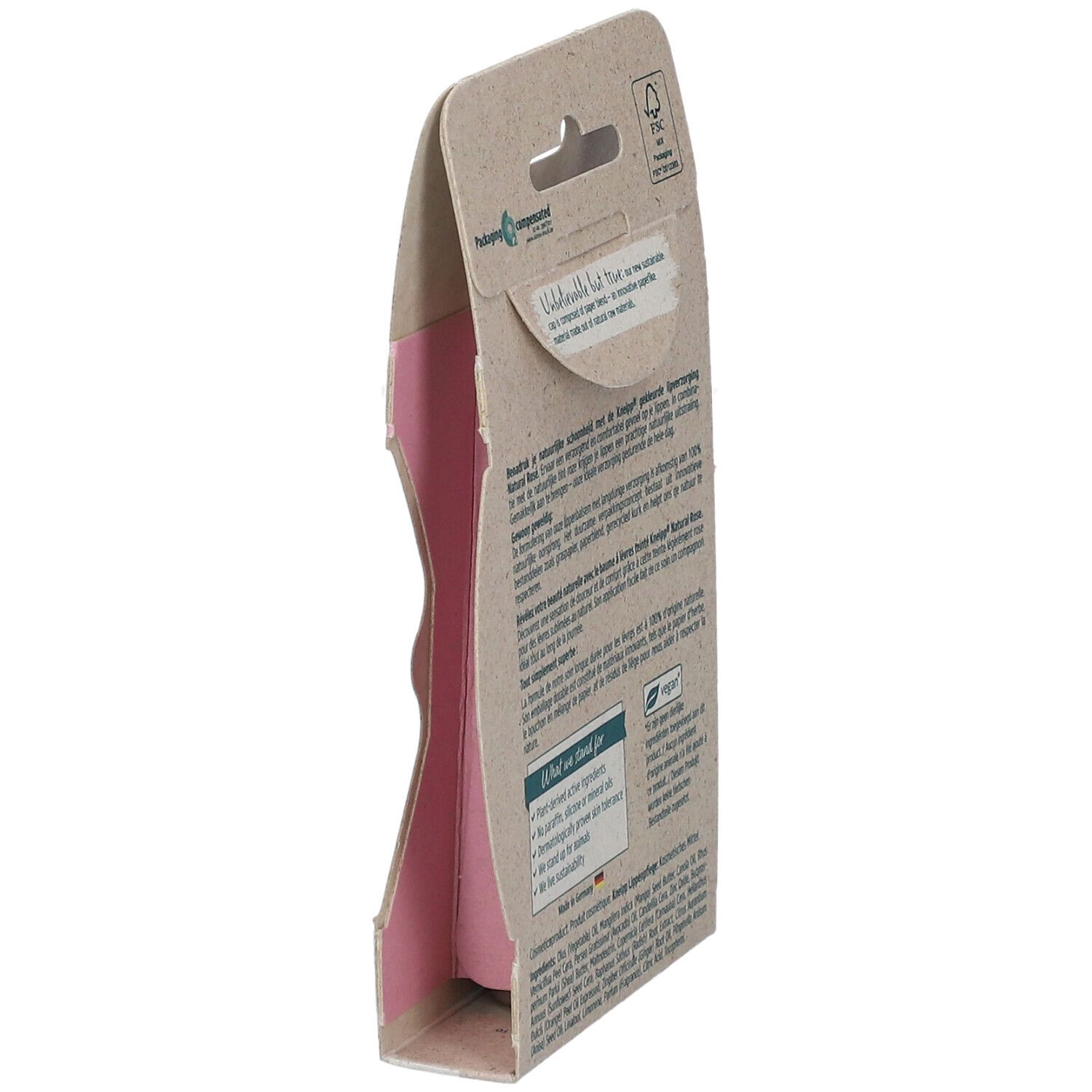Vue latérale de l'emballage en carton avec texte. Contient des informations sur les ingrédients, la durabilité et les certifications. Logo végan.