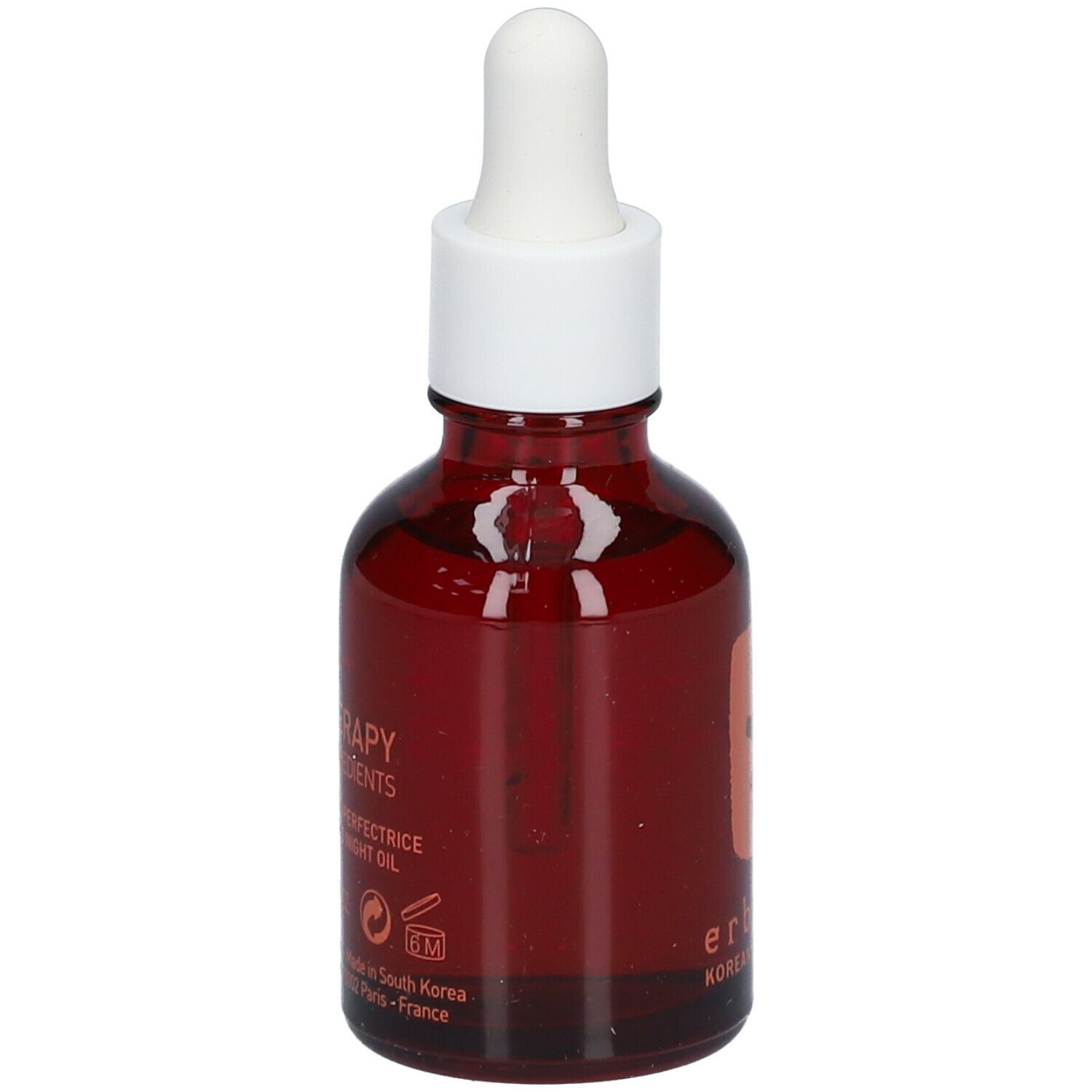Flacon en verre brun avec bouchon et pipette blancs. Inscription : Skin Therapy, Huile de Nuit Multi-Perfectrice.