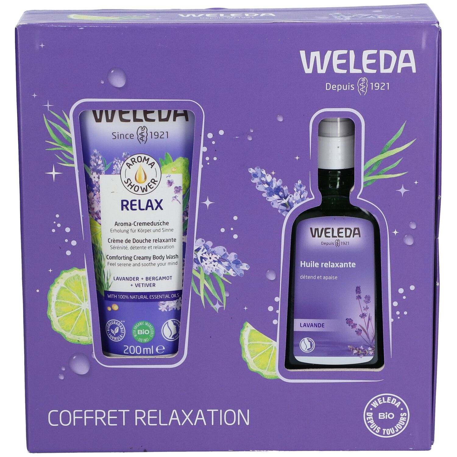 Coffret violet avec gel douche et huile. Inscription: WELEDA, Aroma Shower Relax, Huile relaxante. Logo bio.