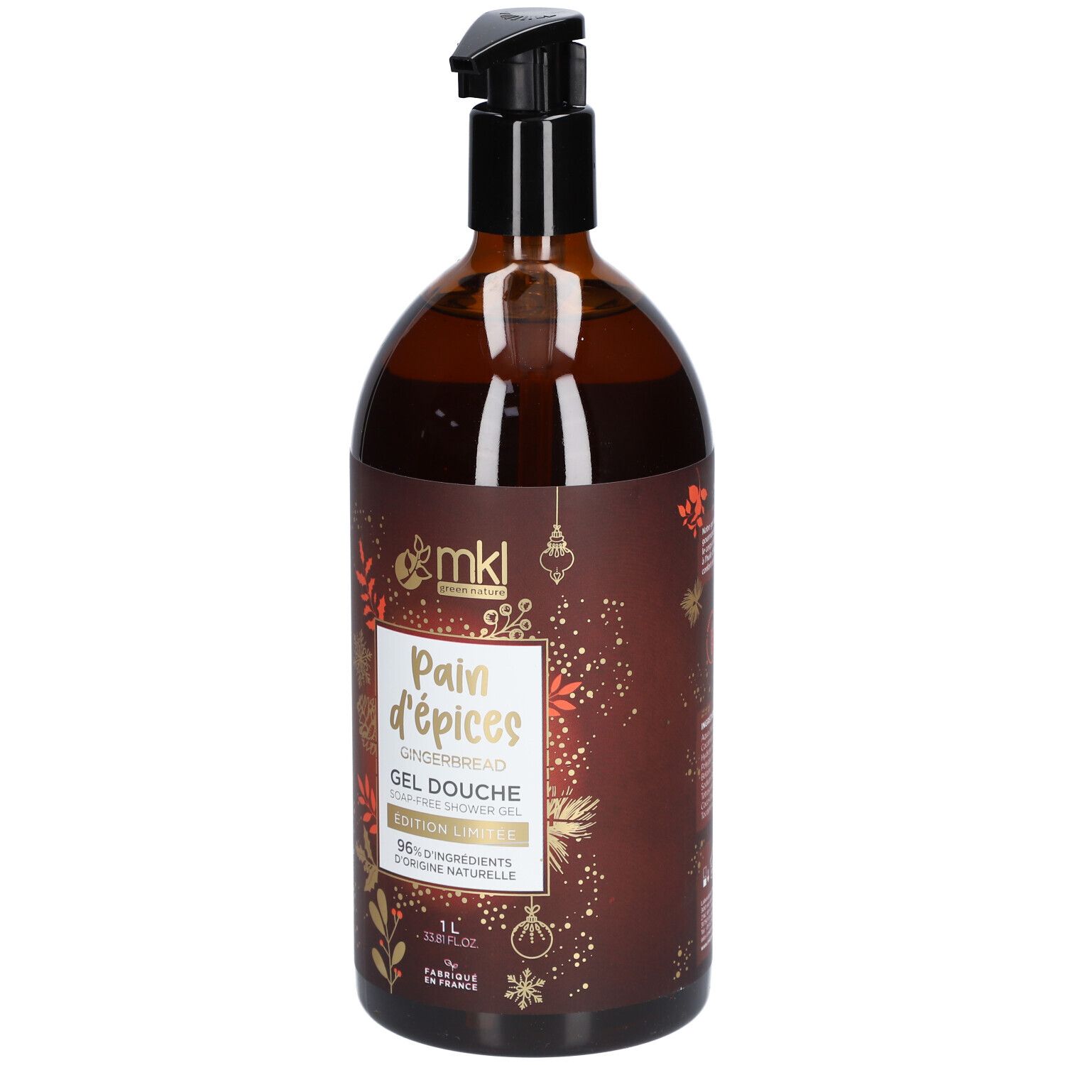 Flacon marron avec pompe noire. Inscription: Pain d'épices, Gel Douche, 1L. Éléments décoratifs.