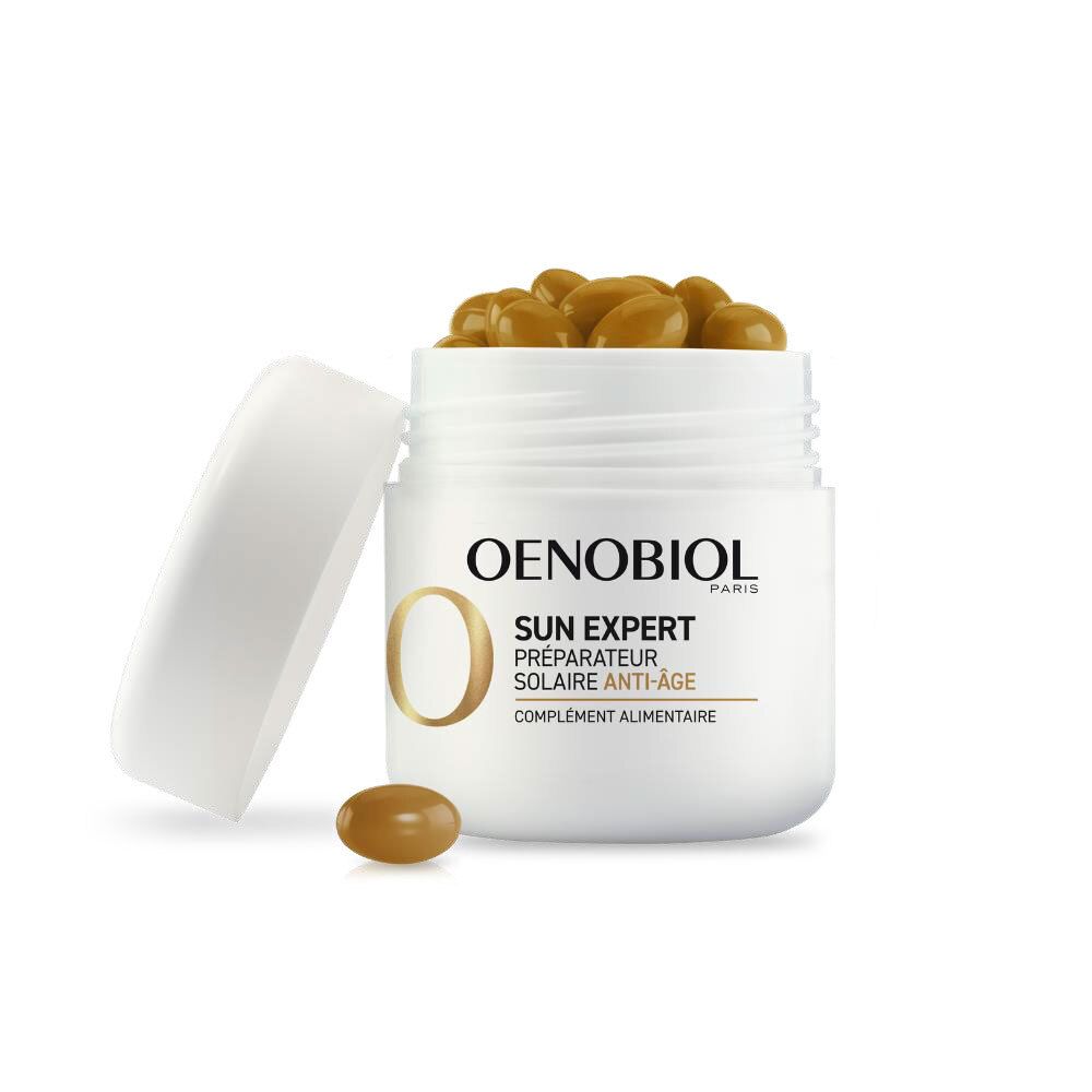 Récipient blanc ouvert avec gélules brunes. Inscription: OENOBIOL SUN EXPERT. Une gélule à côté.