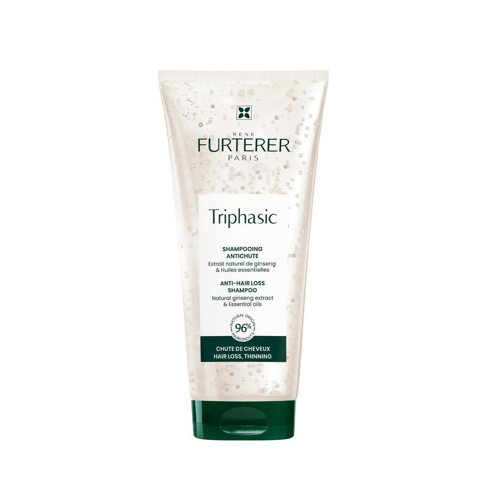 Tube de shampooing sur fond blanc. Inscription : René Furterer, Triphasic, Shampooing antichute. Emballage vert et blanc.