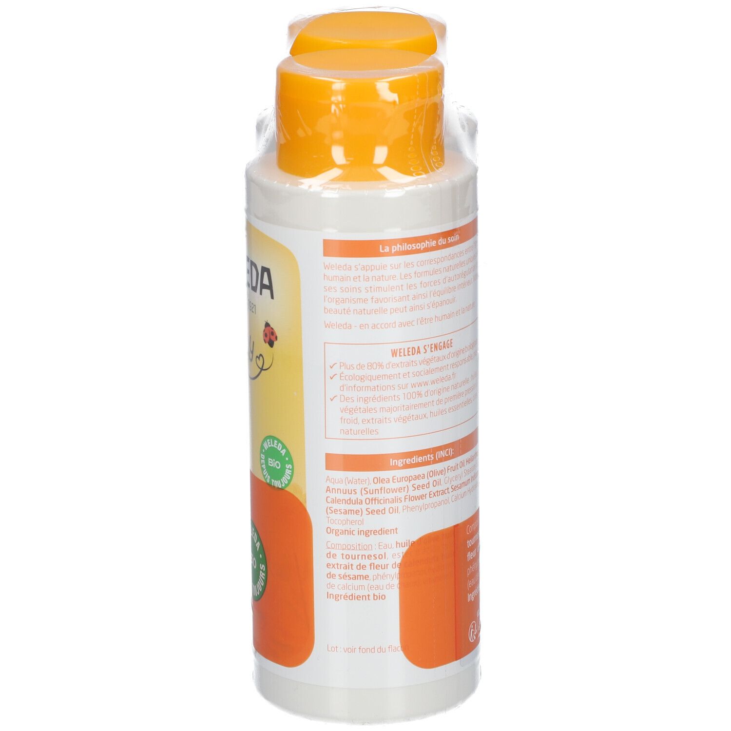 Flacon de liniment bébé, dos, bouchon orange, emballage transparent. Inscription: WELEDA, baby, label bio, ingrédients.