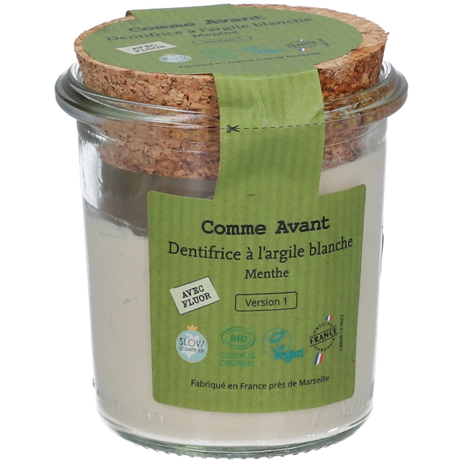 Pot en verre avec pâte blanche, couvercle en liège et étiquette verte. Texte: Comme Avant, dentifrice à l'argile blanche, menthe. Avec fluor. Bio.