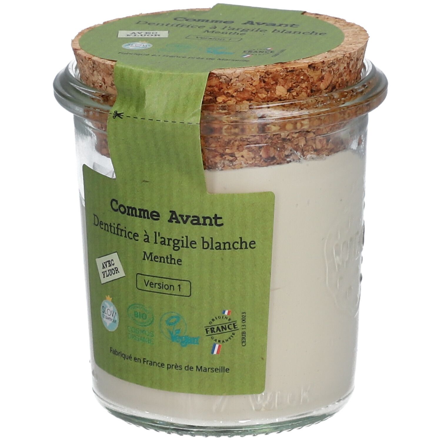 Pot en verre avec pâte blanche, couvercle en liège et étiquette verte. Texte: Comme Avant, dentifrice à l'argile blanche, menthe. Avec fluor. Bio.