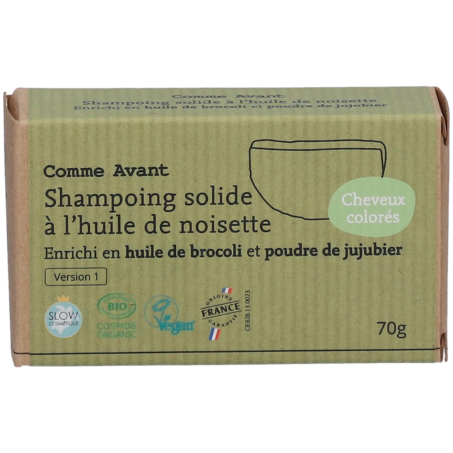 Boîte en carton avec nom et logo du produit. Texte: Shampoing solide à l'huile de noisette. Certifications Bio et Vegan.