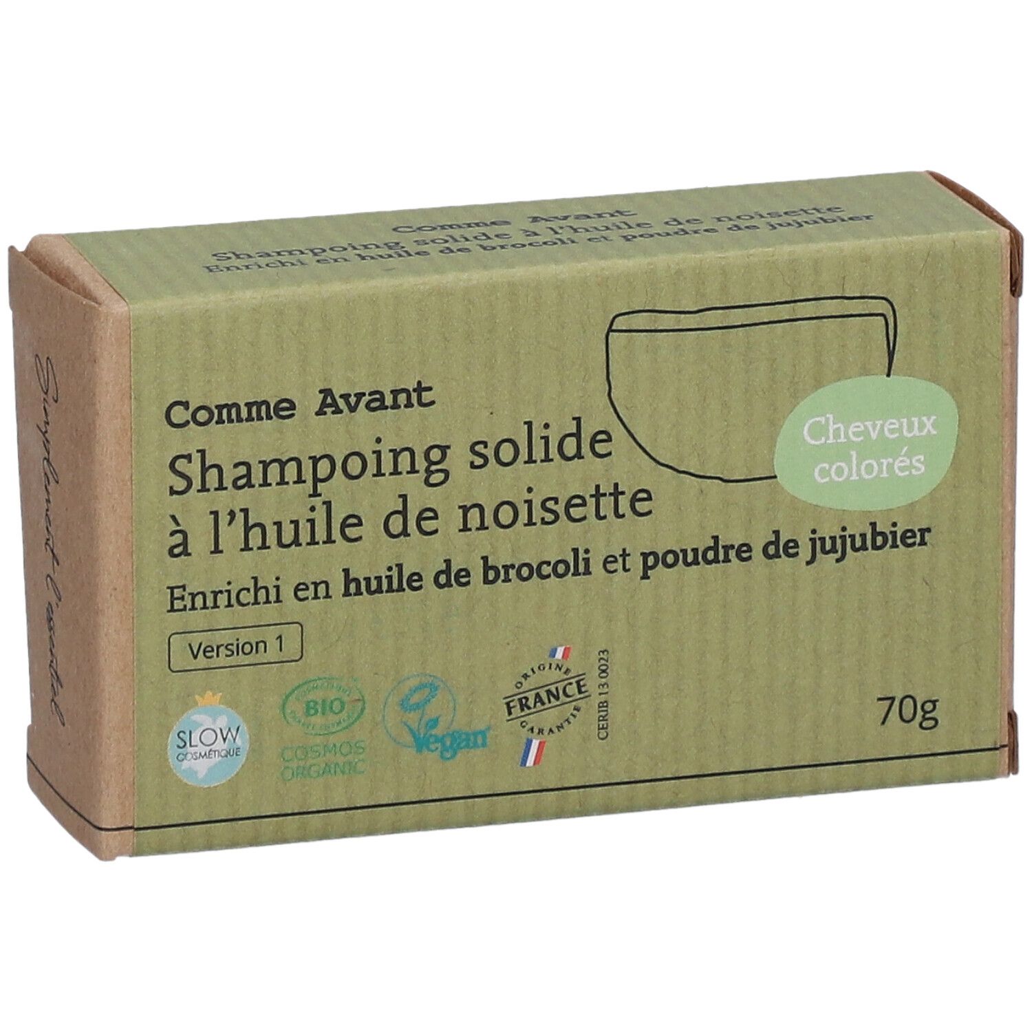 Boîte en carton avec nom et logo du produit. Texte: Shampoing solide à l'huile de noisette. Certifications Bio et Vegan.