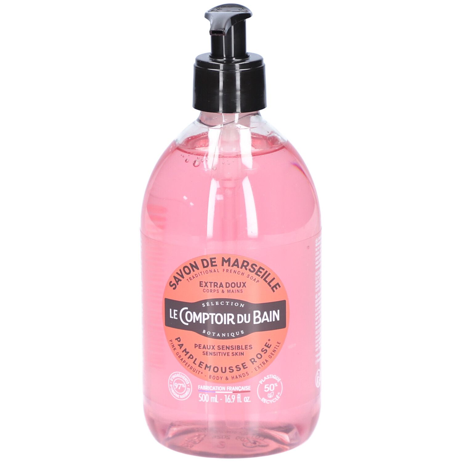 Flacon transparent de savon liquide rose avec pompe noire. Étiquette avec informations produit.