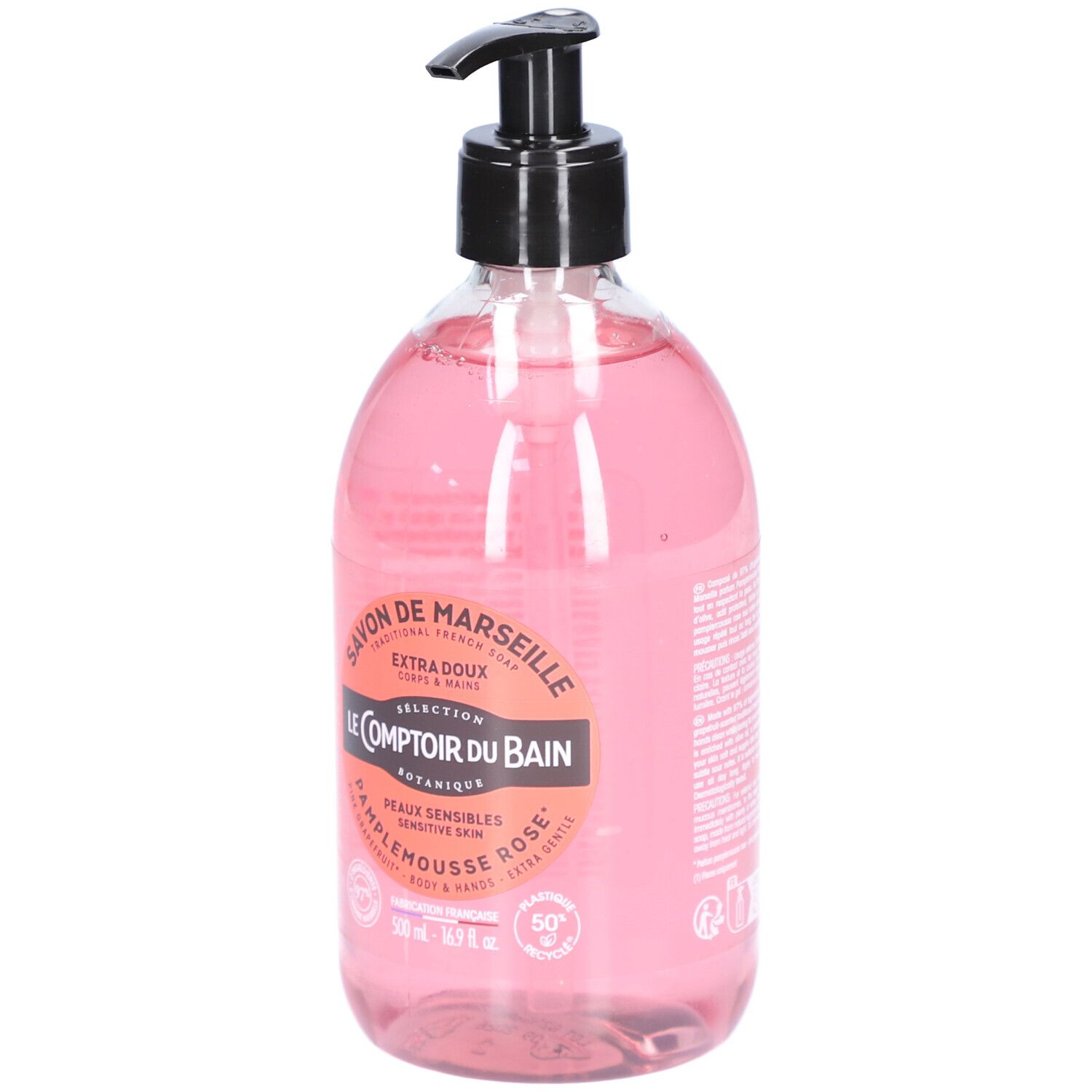 Flacon transparent de savon liquide rose avec pompe noire. Étiquette avec informations produit.